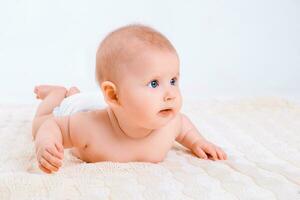 Cute baby girl on white background photo