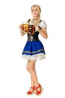 Full length portrait of a blond woman with traditional costume holding beer glasses isolated on white background. photo