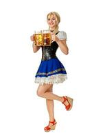 Full length portrait of a blond woman with traditional costume holding beer glasses isolated on white background. photo