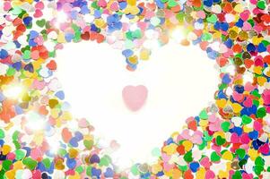 heart shaped confetti on a white background photo