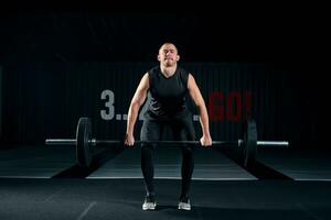 Muscular man bodybuilder training in gym and posing. photo