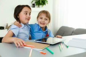 Learning from home, Home school kid concept. Little children study online learning from home with laptop. Quarantine and Social distancing concept. photo