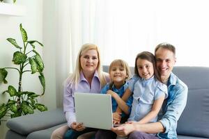 Family Working At Laptop With In Home Office photo