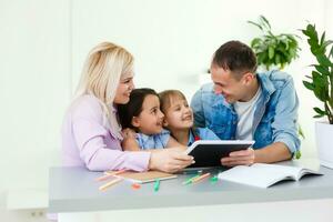 Family Working At Laptop With In Home Office photo