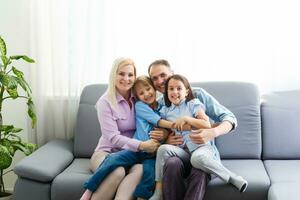 Portrait of a happy family smiling at home photo