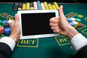 casino, online gambling, technology and people concept photo