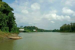 Natural lake view with some forest and boat photo