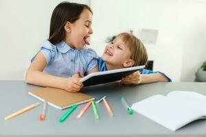 Learning from home, Home school kid concept. Little children study online learning from home with laptop. Quarantine and Social distancing concept. photo