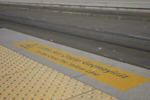 the caution sign at metro station photo