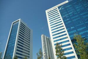 low angle view of istanbul financial bank against blue sky photo