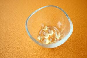 capsules from fish oil in a container photo