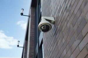 CCTV security camera operating outdoor photo