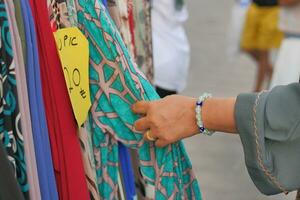 woman choosing clothes in shop. photo