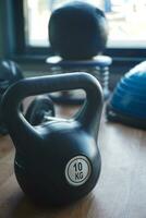 2 kg kettlebell on padded floor at gym photo