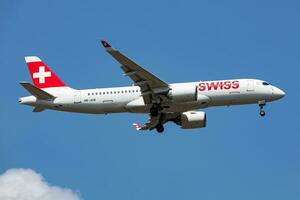Swiss International Airlines Airbus A220-300 passenger plane at airport. Aviation and aircraft. Air transport and travel. Fly and flying. photo