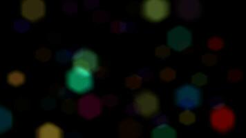 Bokeh shining colorful particles. Shimmering Glittering Particles loop animation with black background video