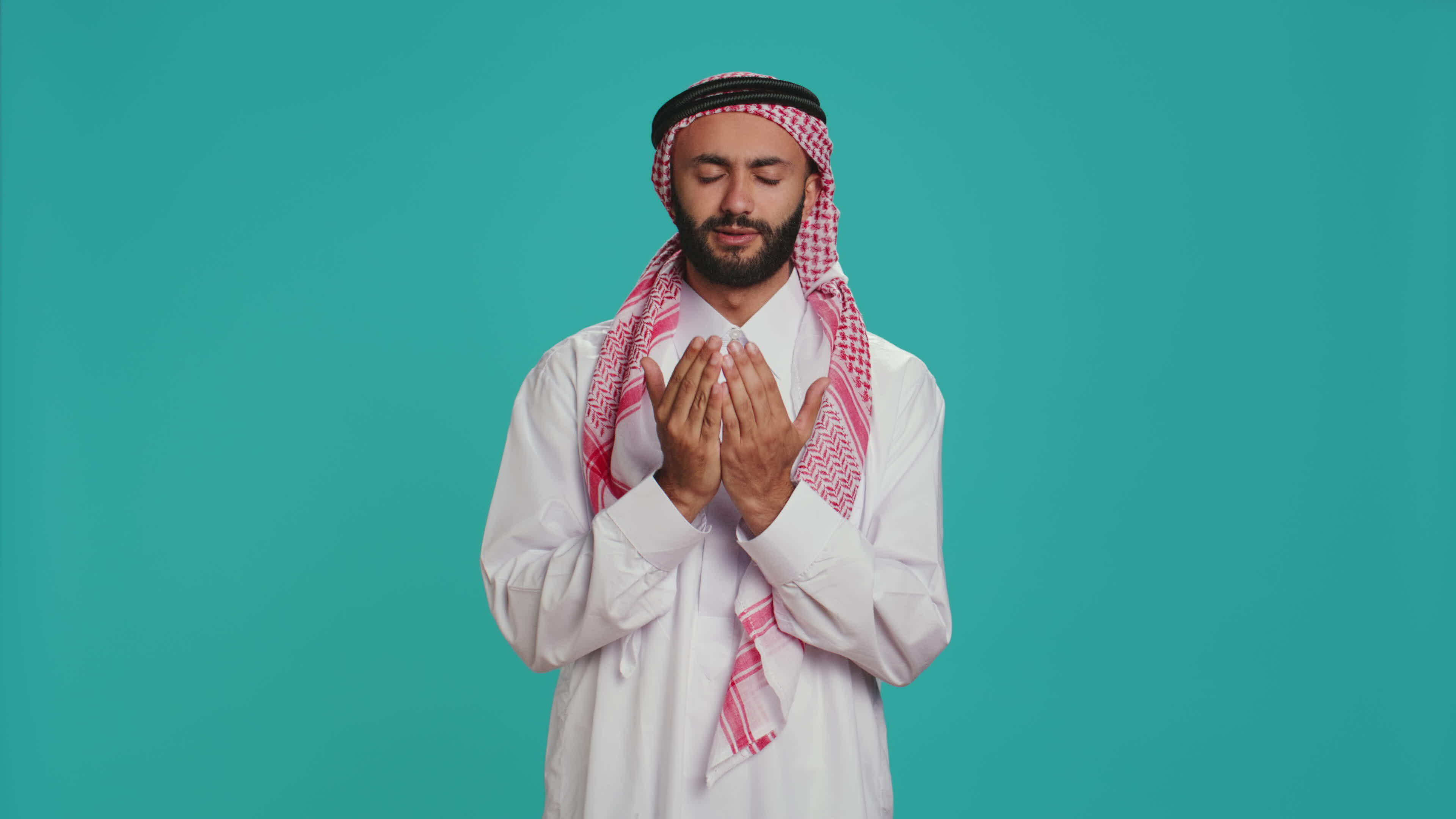 Islamic man praying to allah in studio, having hope in religious ritual