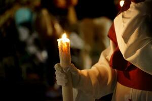 A penitent with his candle on the holy night photo