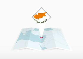 Cyprus is depicted on a folded paper map and pinned location marker with flag of Cyprus. vector