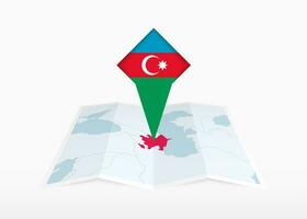 Azerbaijan is depicted on a folded paper map and pinned location marker with flag of Azerbaijan. vector