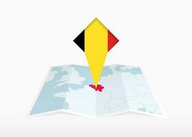 Belgium is depicted on a folded paper map and pinned location marker with flag of Belgium. vector