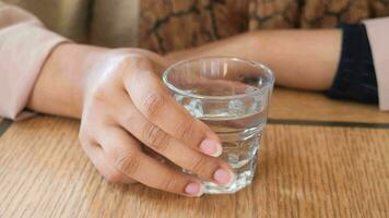 women holding a glass of water video