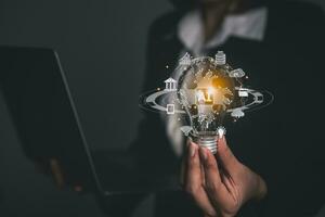 Woman hold Bulb Lighting virtual digital Ai network chain. Digital transformation change management, internet of things, smart Ai technology, IoT concepts business icons smart Internet of Things. photo