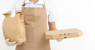 Diverse of paper containers for takeaway food. Delivery man is carrying photo