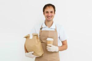 Diverse of paper containers for takeaway food. Delivery man is carrying photo