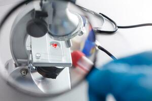 Microscope on the table with chemical tube and glassware in laboratory, Science research technology photo