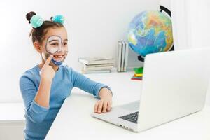 Little actress, little girl studying theater on laptop online photo