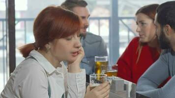 Sad woman drinking beer at the pub video