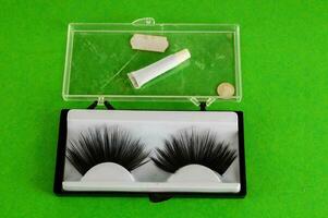 two pairs of false eyelashes in a clear box photo