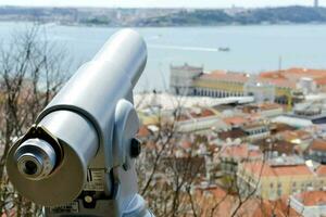 a pair of binoculars overlooking the city of lisbon photo