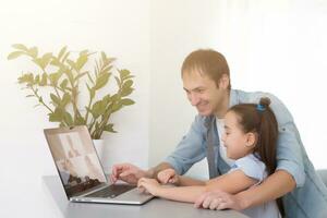 Digital composite of People using a computer with E-Learning information in the screen photo