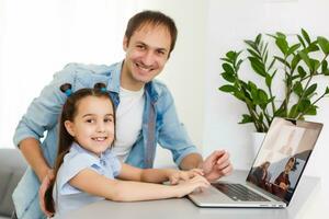 Digital composite of People using a computer with E-Learning information in the screen photo