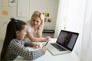 Digital composite of People using a computer with E-Learning information in the screen photo