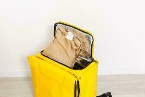 Cropped view of delivery thermo bag on grey, photo