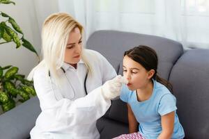 child is measured by the temperature of a thermometer, a cold and the flu is at home with a high temperature, the doctor checks the patient, photo