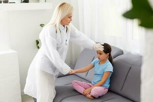 Doctor and little girl in the office photo