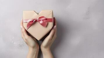 AI generated Symbol of Love. Close-Up on Female Hands Holding a Heart-Shaped Gift for Valentine's Day, Birthday, Mother's Day. photo