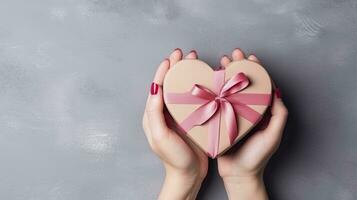 AI generated Symbol of Love. Close-Up on Female Hands Holding a Heart-Shaped Gift for Valentine's Day, Birthday, Mother's Day. photo