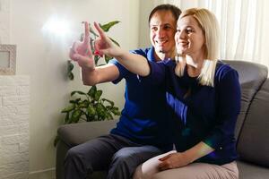 man and woman press virtual smart home photo