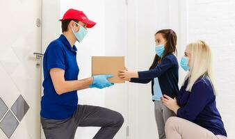 Courier delivering a parcel, delivery of things during quarantine photo