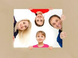 family holds holds photo canvas at home