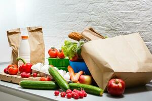 healthy food background, vegetables, fruits, eggs and dairy products on white table, top view photo