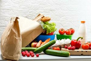 healthy food background, vegetables, fruits, eggs and dairy products on white table, top view photo