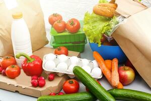 healthy food background, vegetables, fruits, eggs and dairy products on white table, top view photo