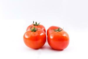 red ripe tomatoes isolated on white background photo