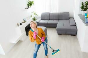 Young woman doing housework, cleaning photo